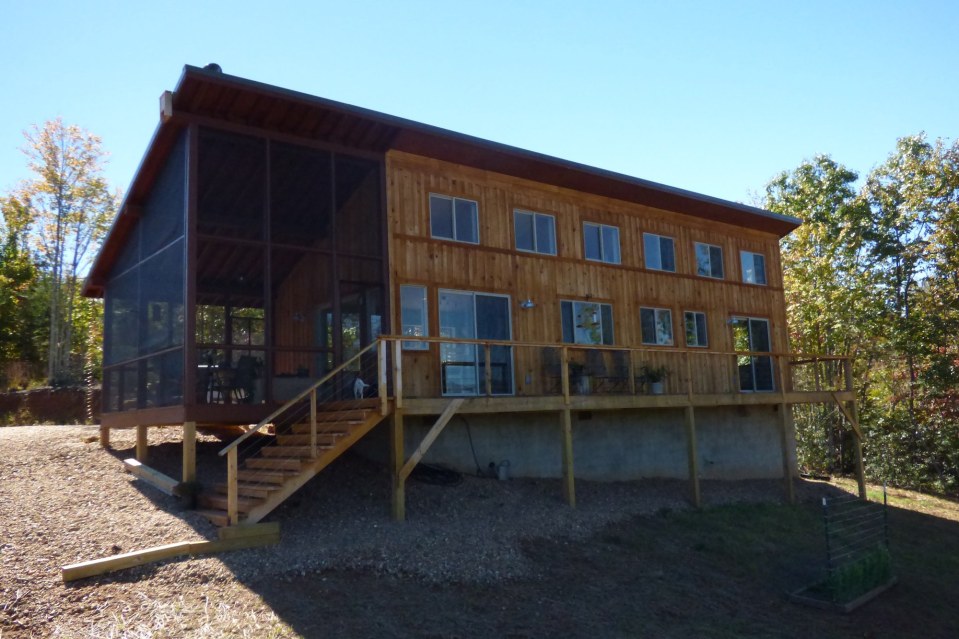 A modern cabin in the hills of North Carolina. It has one bedroom on the 704 sq ft ground floor plus a loft. | www.facebook.com/SmallHouseBliss